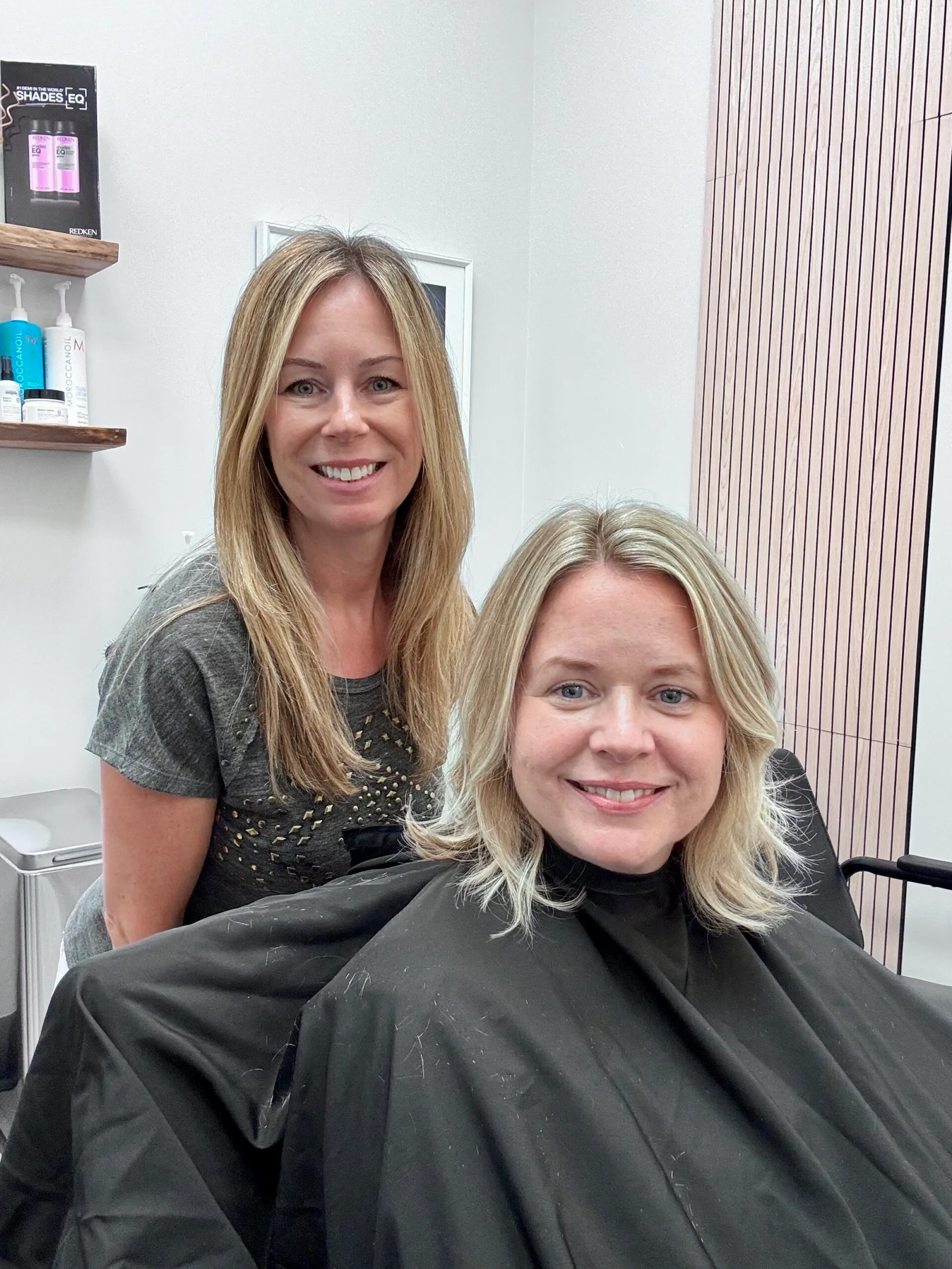 Smiling client with fresh blonde haircut and stylist Marisa at MZ Hair Studio in Bridgewater, NJ, after a precision cut and color service.
